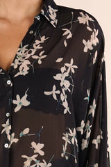 SHEER LONG SLEEVE BUTTON DOWN FLORAL TOP